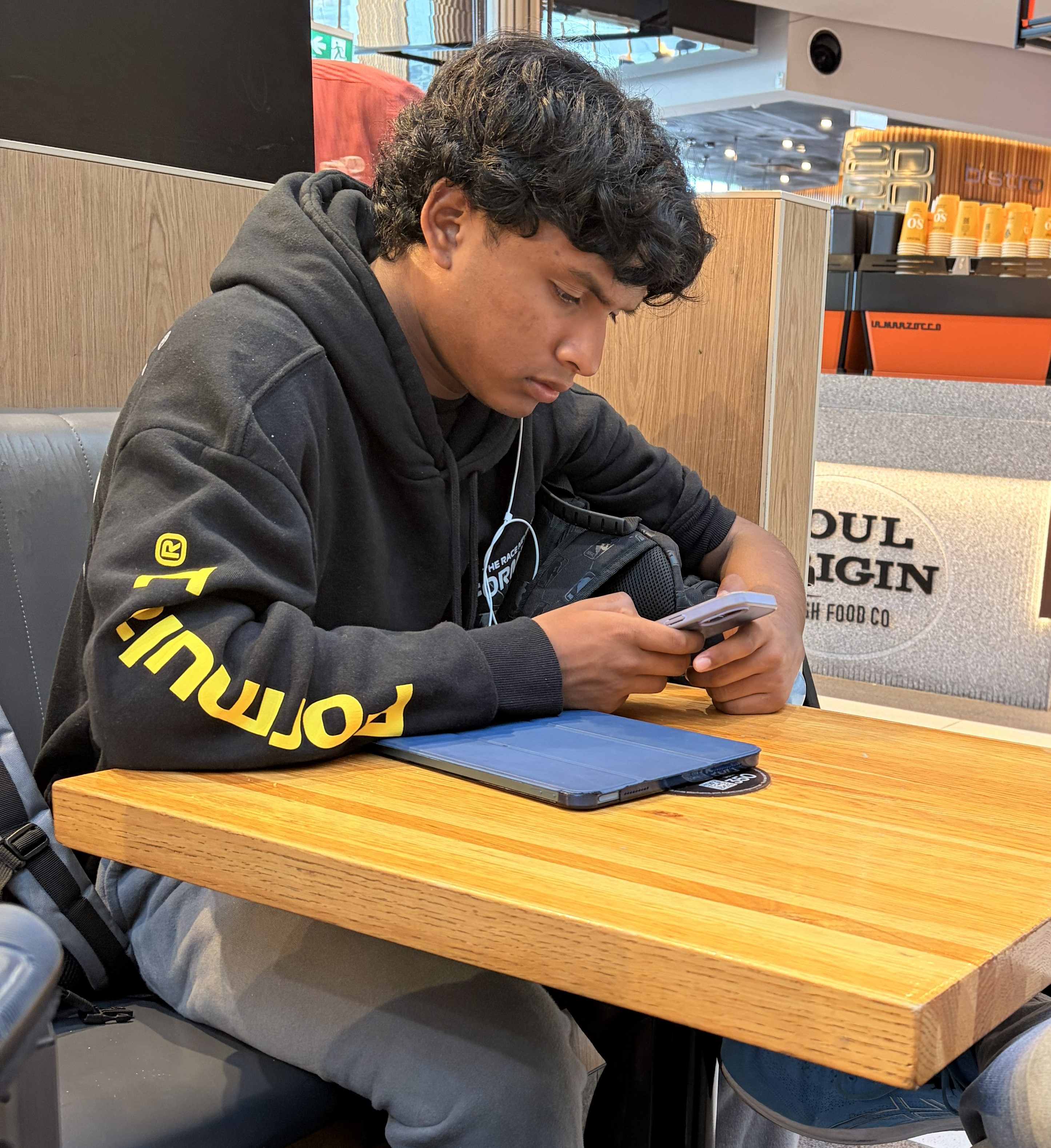 Zayne with CircuitRunners robot at FTC competition