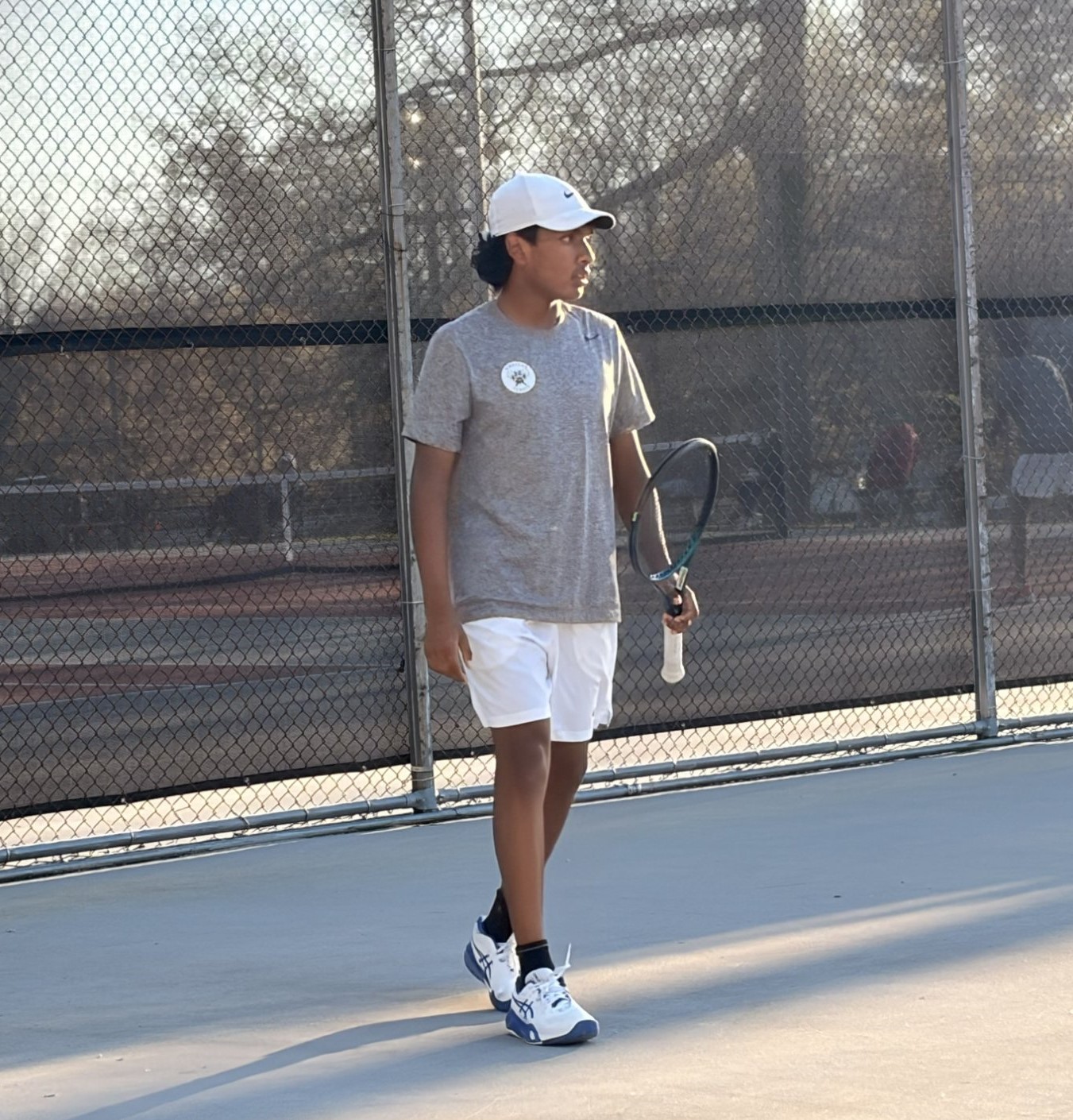 Zayne focused on the tennis court during a match